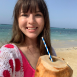 jude drinking out of a coconut.webp